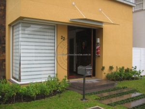 Porta pivotante reforçada com metalon de ferro, revestida com lambril de imbuia, visor de vidro fumê - Imagem 6