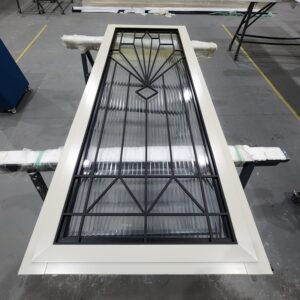 Porta em ACM com grade de ferro especial